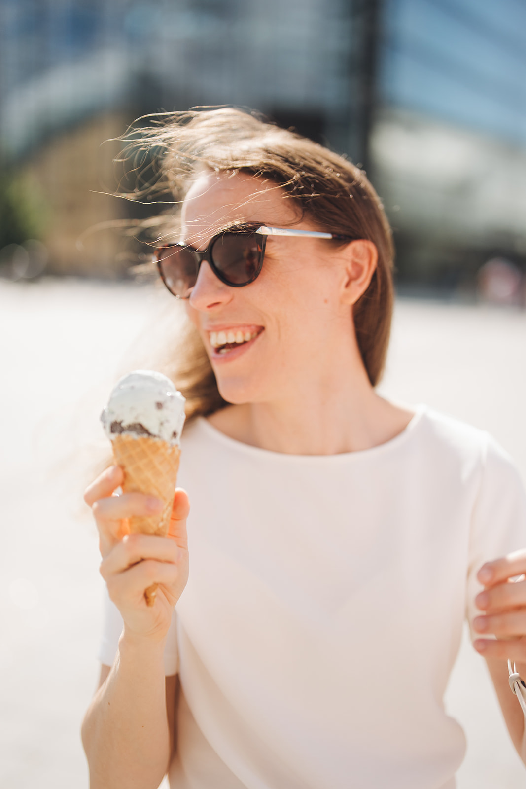 Sonja Rajala smiling with an ice cream cone in the sun